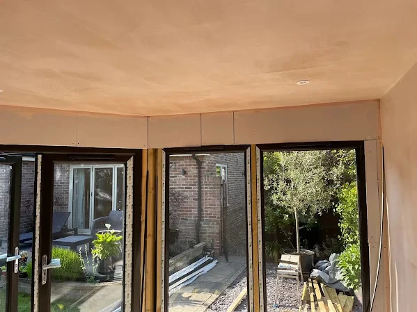 Plastering over artex to create a modern flat ceiling